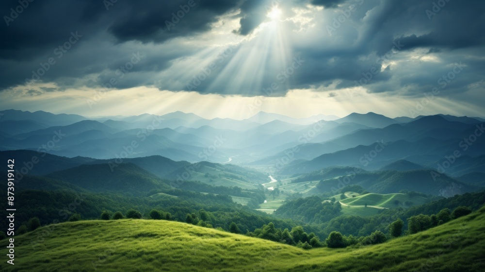 Obraz premium the morning sun shines through the clouds on the mountains of the valley and the forest in the fog.