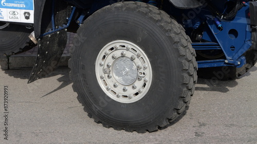 A large truck with a huge tire on the front © Andrey