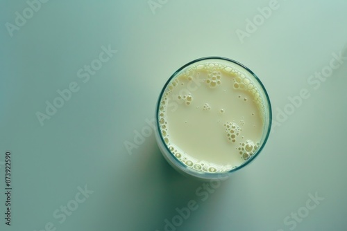 Milk Top View. Glass of Cold Fresh Dairy Drink with Cream on Top