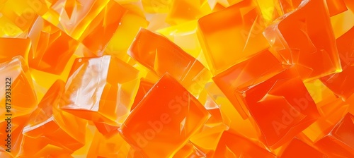 Abstract background made from orange jello chunks. Backlit clear ice or jelly cubes. Candy sweets