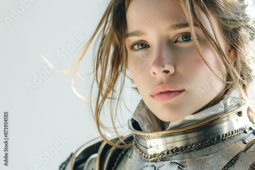 Beautiful young lady knight in detailed armor, isolated on a white background photo