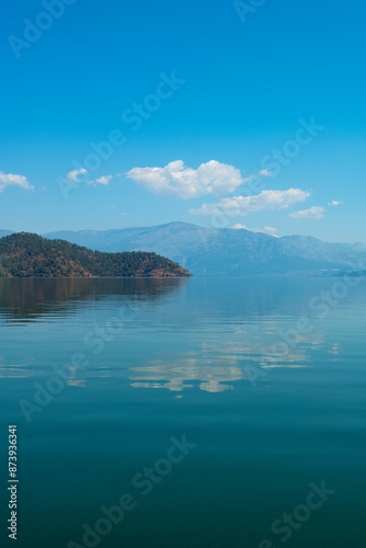 reflection of the forest in the lake.Bay views from green forests. View from the forest to the sea. Magnificent views from the forest to the sea. Magnificent bays of Muğla.