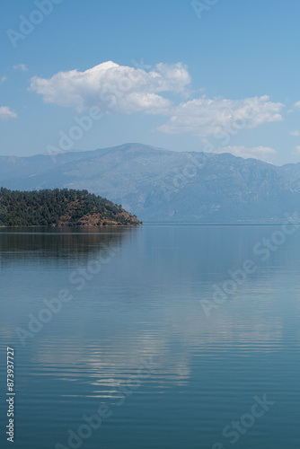 reflection of the forest in the lake.Bay views from green forests. View from the forest to the sea. Magnificent views from the forest to the sea. Magnificent bays of Muğla.