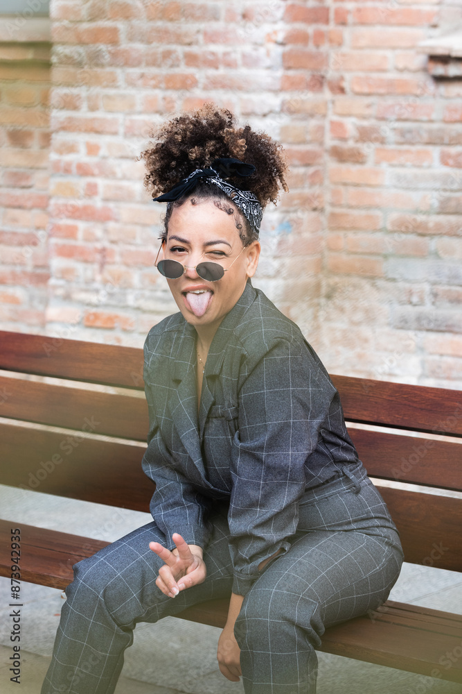 Fashion, beauty and mockup with a black woman in glasses sitting on a bench. Style, edgy and trendy with an attractive female posing with cool sunglasses Fashion, beauty and mockup with a black woman in glasses sitting on a bench. Style, edgy and trendy with an attractive female posing with cool sunglasses