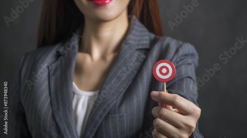 businesswoman holding a tar...