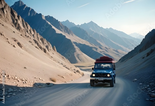 A blue off-road car driving through a mountainous desert landscape