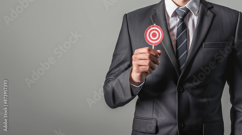 businessman holding a targe...
