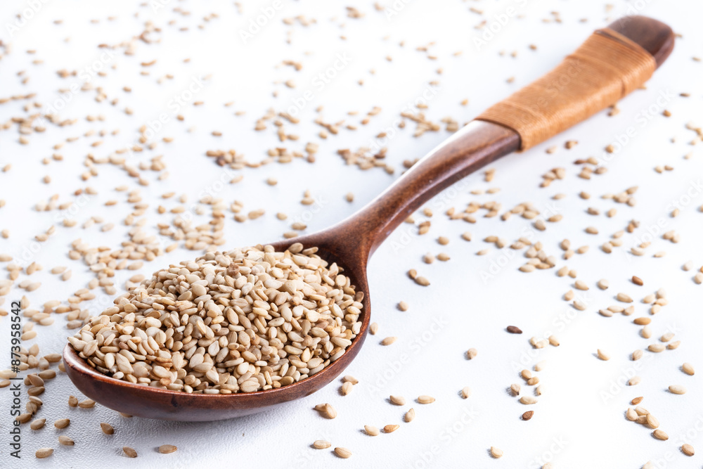 Rolled oats on wooden spoon isolated on white background, healthy breakfast cereal oat flakes Rolled oats on wooden spoon isolated on white background, healthy breakfast cereal oat flakes