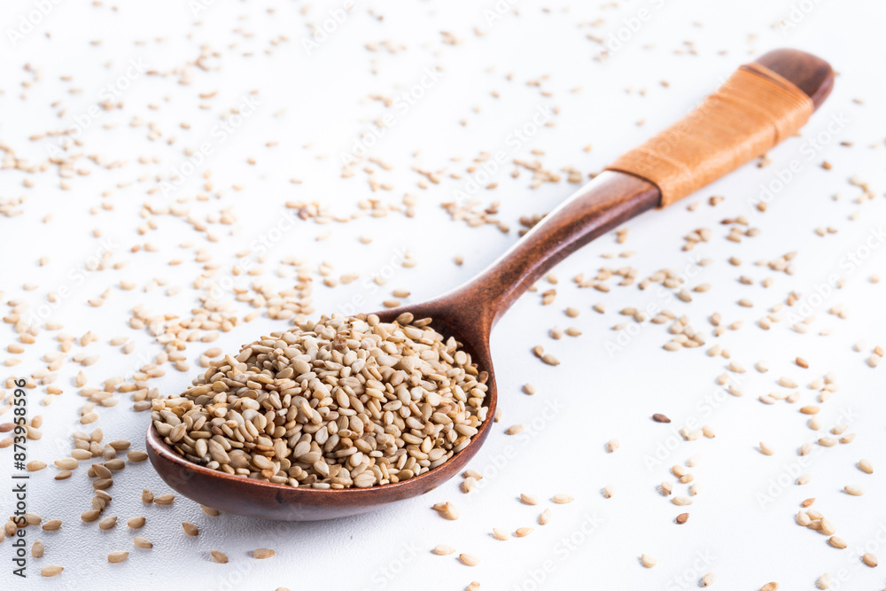 Rolled oats on wooden spoon isolated on white background, healthy breakfast cereal oat flakes Rolled oats on wooden spoon isolated on white background, healthy breakfast cereal oat flakes