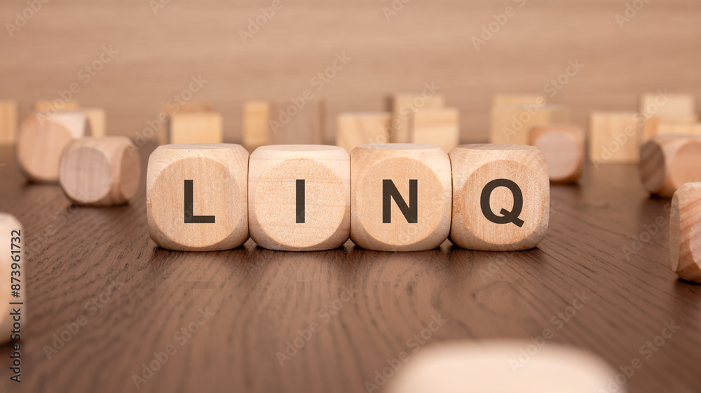 four wooden cubes with the text 'LING' on a brown background four wooden cubes with the text 'LING' on a brown background