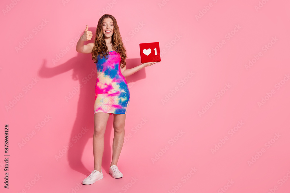 Full length photo of shiny attractive lady dressed vintage clothes showing thumb up holding heart like sign empty space isolated pink color background Full length photo of shiny attractive lady dressed vintage clothes showing thumb up holding heart like sign empty space isolated pink color background