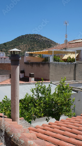 Cityscape with fireplace. Rooftops in rural Mediterranean population.