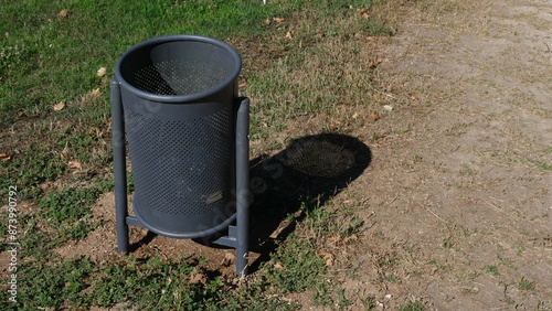 Urban furniture in parks. Garbage bin.