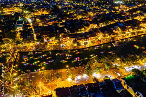 Aerial view of Hoi An Ancient Town with lantern boats on Hoai river, in Hoi An, Vietnam photo