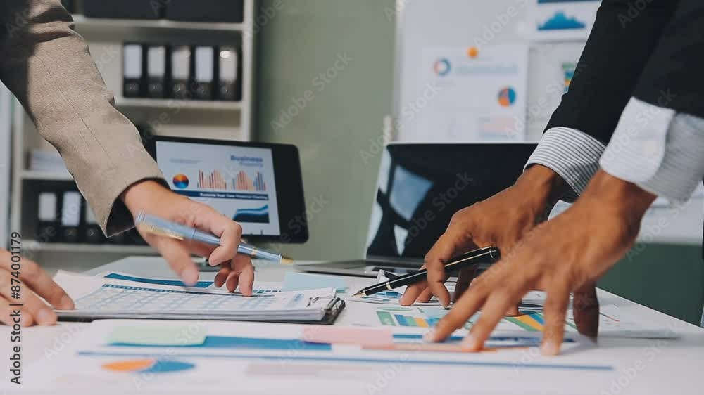 Business meeting time,business account managers crew working with new startup project,report analysis cost graph on desk at meeting room. Business meeting time,business account managers crew working with new startup project,report analysis cost graph on desk at meeting room.