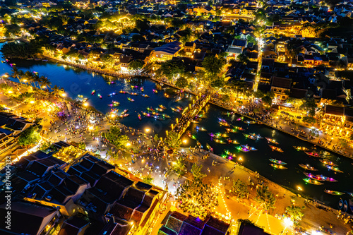 Aerial view of Hoi An Ancient Town with lantern boats on Hoai river, in Hoi An, Vietnam photo