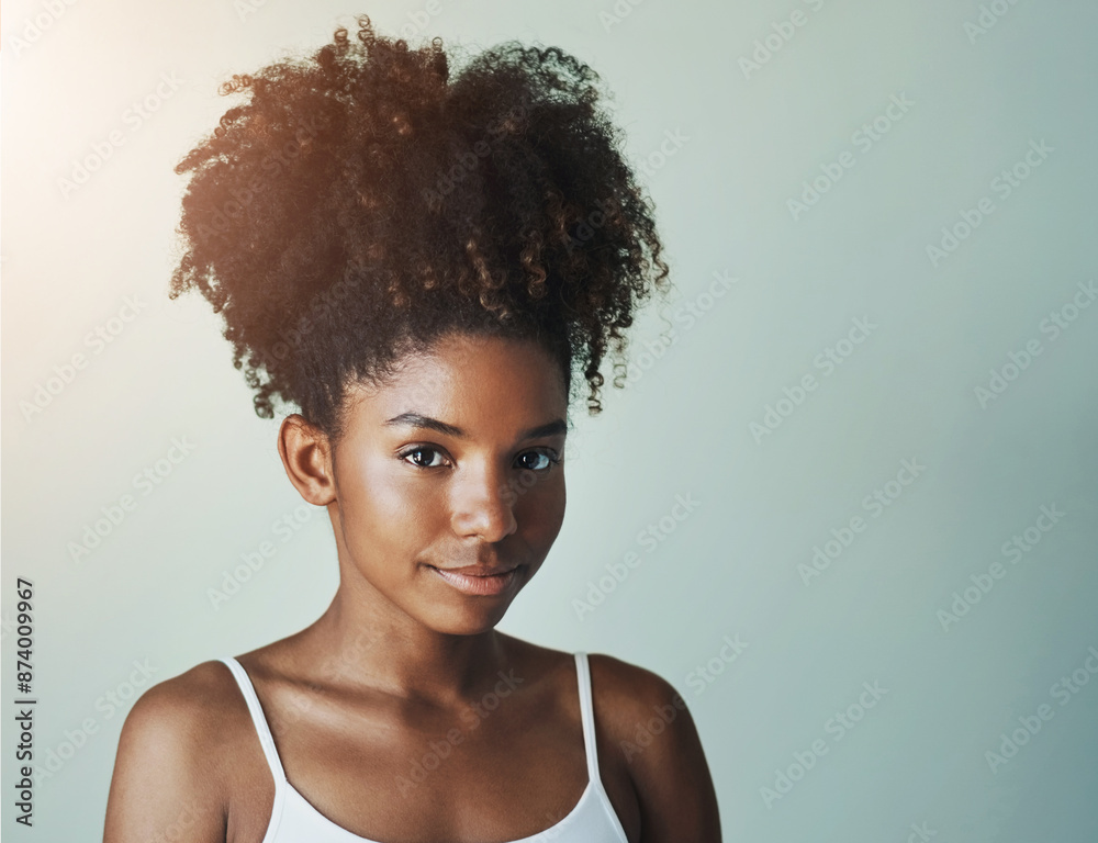 Portrait, skincare and beauty of black woman with glow in studio isolated on gray background. Face, makeup and confident model in cosmetics with curly hairstyle at salon for health, shine or mockup Portrait, skincare and beauty of black woman with glow in studio isolated on gray background. Face, makeup and confident model in cosmetics with curly hairstyle at salon for health, shine or mockup