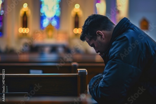 Man praying in the church adult disappointment contemplation. photo