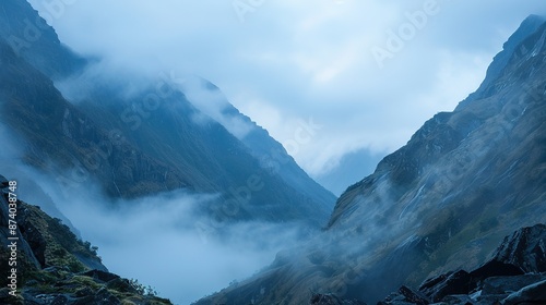 Mountain valley: Rocks and fog with subtle details in foreground. © Li