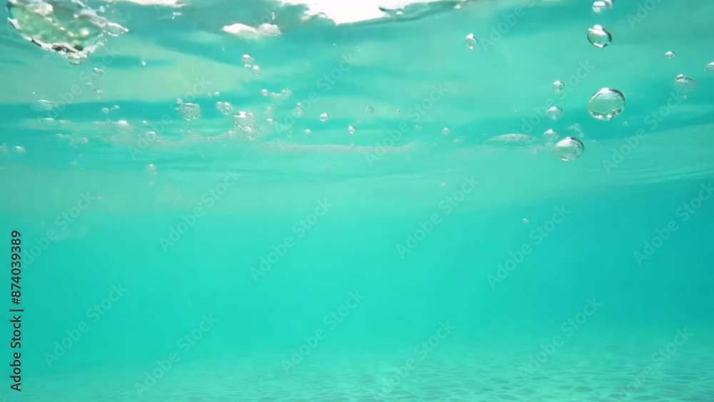Clear blue water shimmers in a pool, sunlight dancing on the surface Clear blue water shimmers in a pool, sunlight dancing on the surface