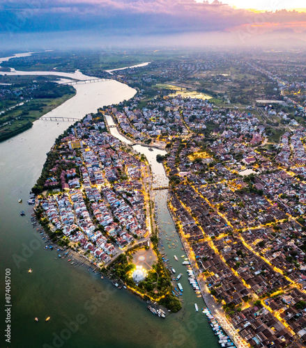 Aerial view of Hoi An Ancient Town with lantern boats on Hoai river, in Hoi An, Vietnam photo