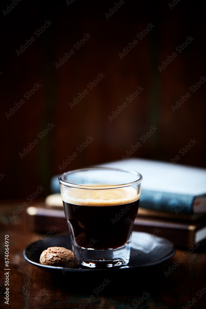 Coffee in glass cup on dark background. Close up. Copy space Coffee in glass cup on dark background. Close up. Copy space