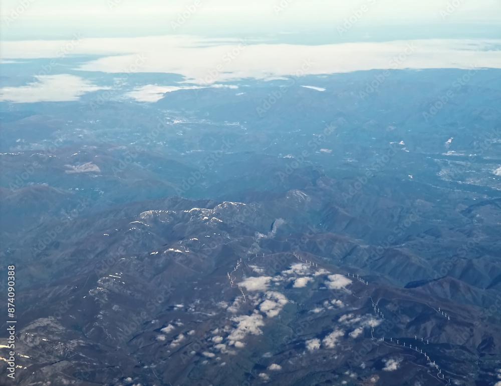 aerial view of spanish mountains with snow and clouds aerial view of spanish mountains with snow and clouds
