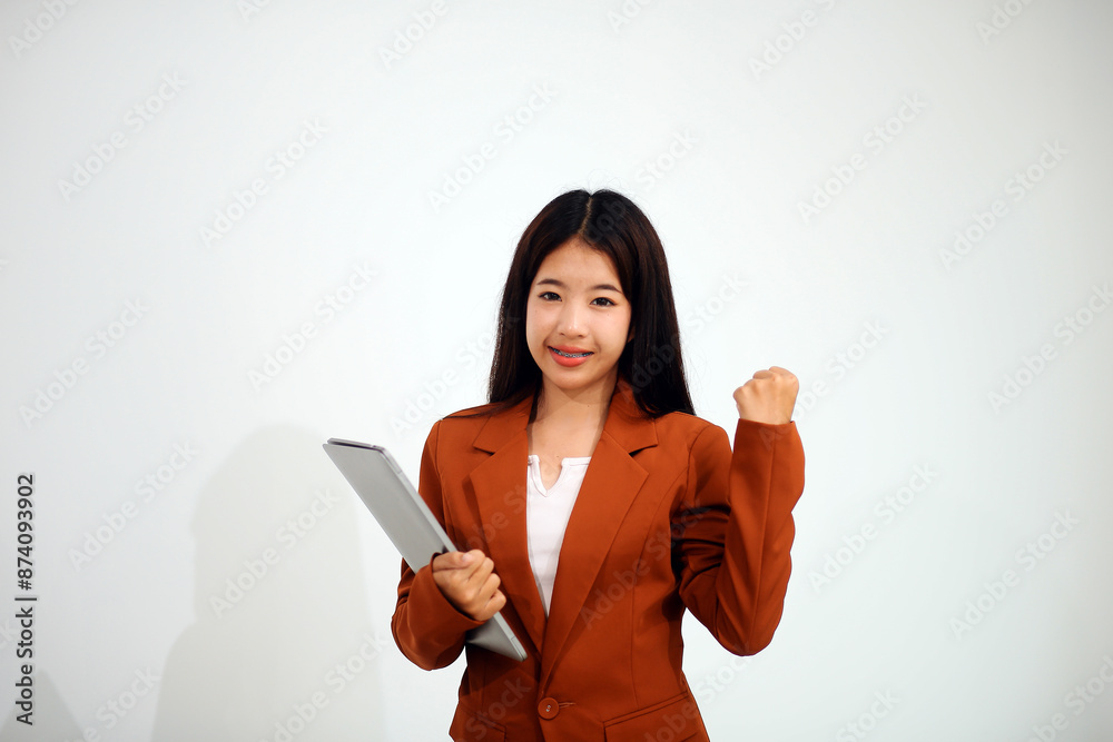 Young beautiful Asian woman in business office standing use tablet in hand, Thai girl enjoy browsing for online shopping store with copy space for advertisement, on isolated white background Young beautiful Asian woman in business office standing use tablet in hand, Thai girl enjoy browsing for online shopping store with copy space for advertisement, on isolated white background
