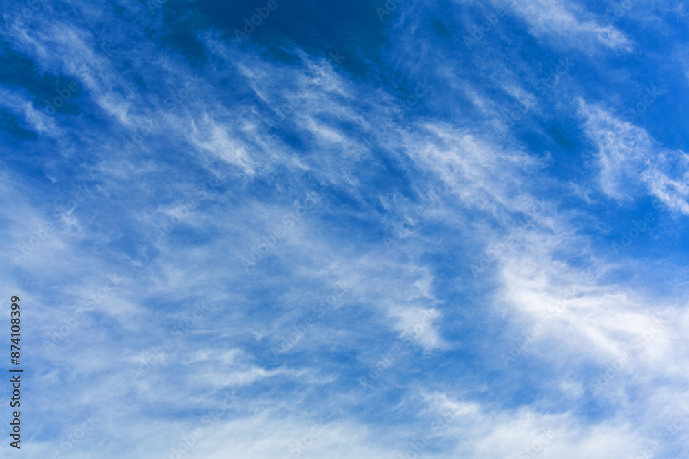 Image of a smattering of light clouds against a blue sky. Image of a smattering of light clouds against a blue sky.