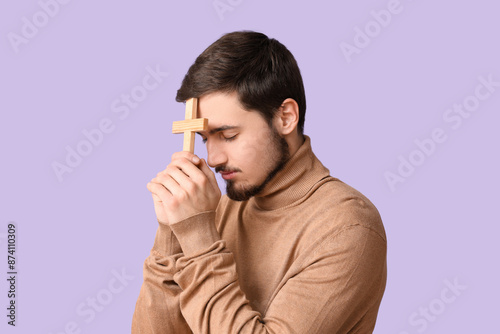 Religious young man praying...