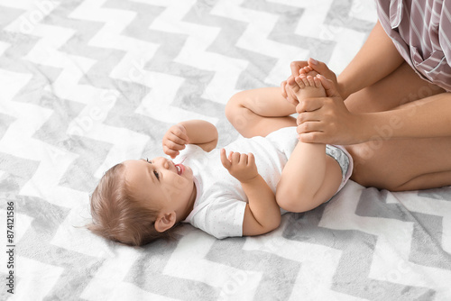 Cute little baby with mothe...