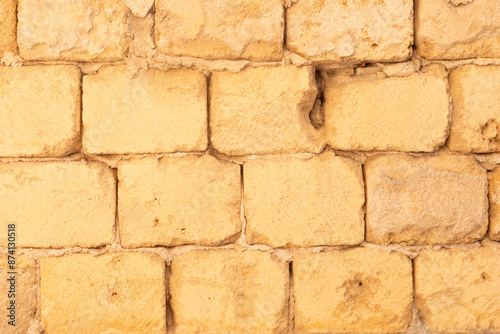 A weathered brick wall with...