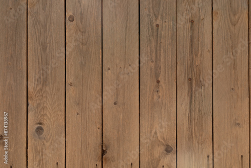 A weathered wooden fence wi...
