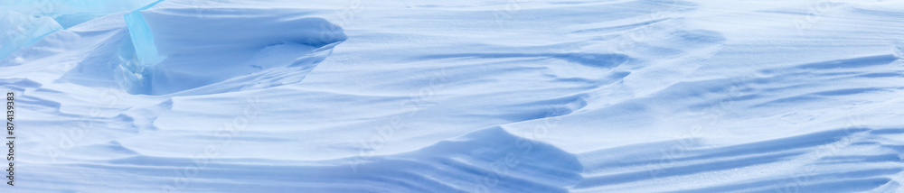 Panoramic view of blue and white abstract natural textured background of snowy ice surface on frozen Baikal Lake on frosty winter day. Texture of snow crust. Copy space, blank, Christmas mock up Panoramic view of blue and white abstract natural textured background of snowy ice surface on frozen Baikal Lake on frosty winter day. Texture of snow crust. Copy space, blank, Christmas mock up
