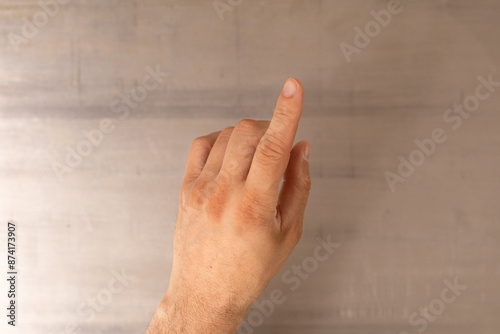 A hand points to the right