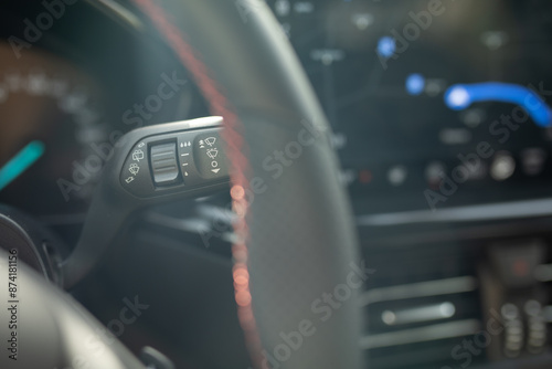 A close up of a car s steering wheel controls