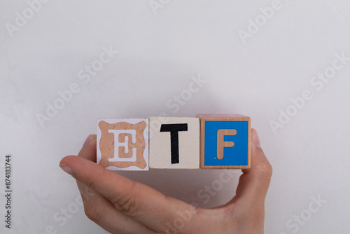 Wooden blocks spelling out ETF