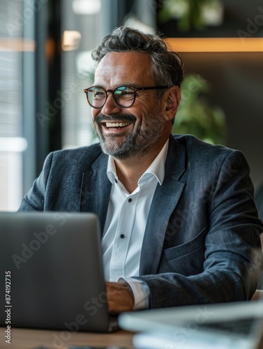 A person sitting at a desk with a laptop, possibly working or studying