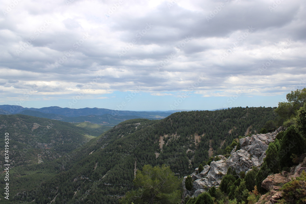 Mountains of El Maestrazgo, Castellón, Spain, rugged, rocky, colorful, and with trees Mountains of El Maestrazgo, Castellón, Spain, rugged, rocky, colorful, and with trees