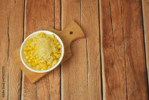 Shaved corn sprinkled with cheese and sweet milk photo