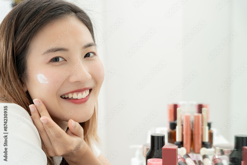 Beautiful Asian woman smile use cream for good skin. face of a healthy woman apply cream and makeup. Advertisement for skin cream, anti-wrinkle, baby face, whitening, moisturizer, tighten pores serum Beautiful Asian woman smile use cream for good skin. face of a healthy woman apply cream and makeup. Advertisement for skin cream, anti-wrinkle, baby face, whitening, moisturizer, tighten pores serum