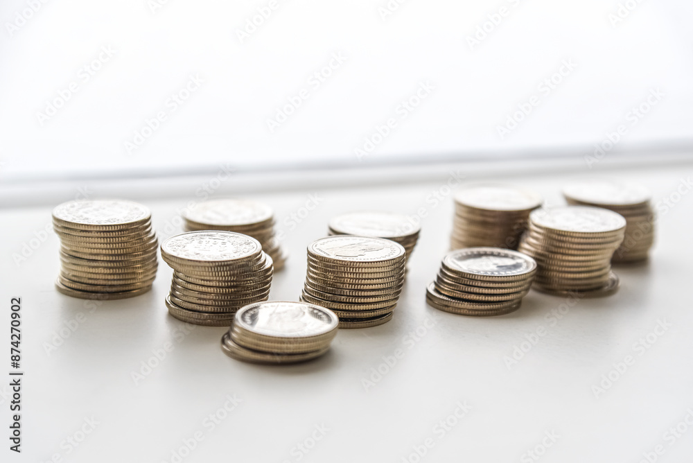 stack of coins spread on white background