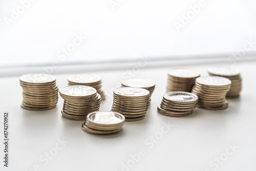 Obraz na płótnie stack of coins spread on white background w salonie