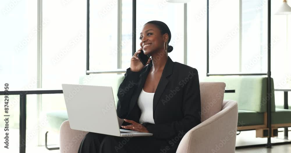 Cheerful beautiful African American business woman speaking on mobile phone at laptop, working from co-working cafe, talking on telephone call, using online app on computer for conversation Cheerful beautiful African American business woman speaking on mobile phone at laptop, working from co-working cafe, talking on telephone call, using online app on computer for conversation
