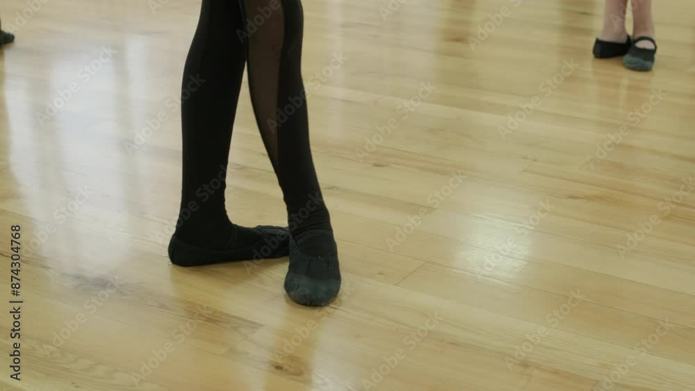 Close-up of ballerina's feet on wooden floor Close-up of ballerina's feet on wooden floor