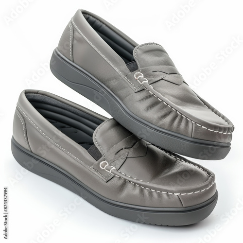 Comfortable grey slip-on loafers with a cushioned footbed, isolated on white background. photo