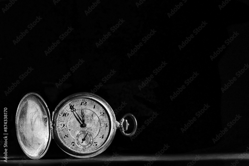 old pocket watch in black and white