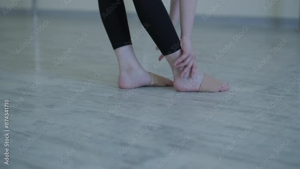 Young Ballerina Practicing Dance Moves in Studio Young Ballerina Practicing Dance Moves in Studio