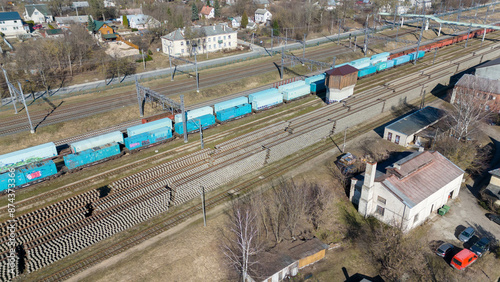 Drone photography of industrial train station with wagons and new railroad storage during spring day