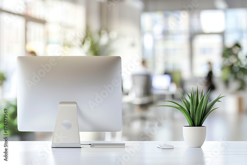 Wallpaper Mural Bright office with computer and potted plant on white desk. Modern workspace with natural light and organized layout. Torontodigital.ca